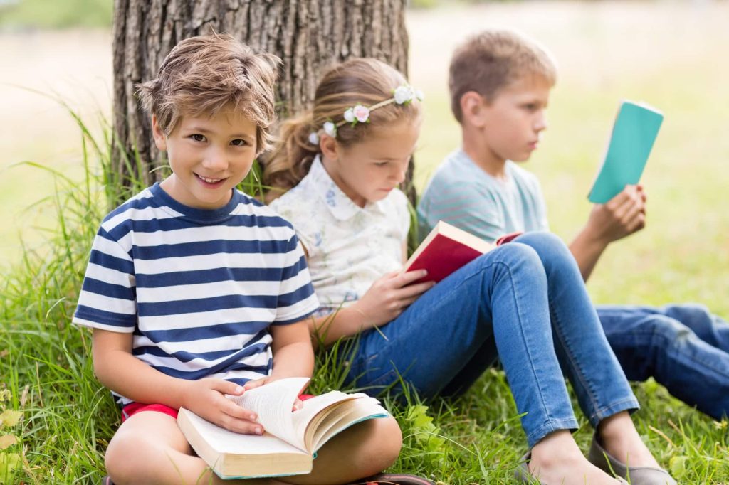 kids-reading-books-in-park.jpg