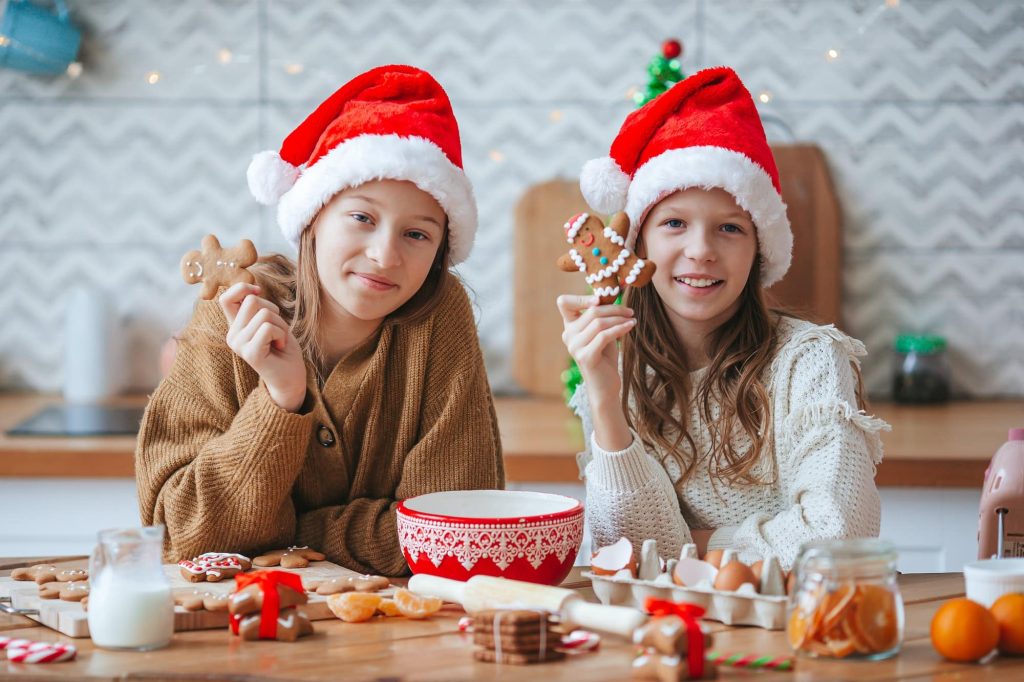 little-girls-preparing-christmas-gingerbread-at-home.jpg